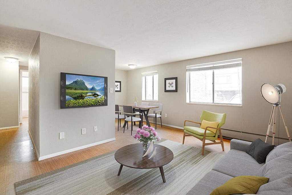 a living room with a couch and a table and a tv