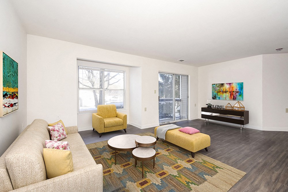 a living room with a couch and two chairs