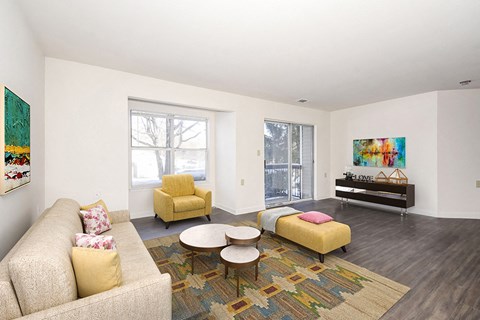a living room with a couch and two chairs
