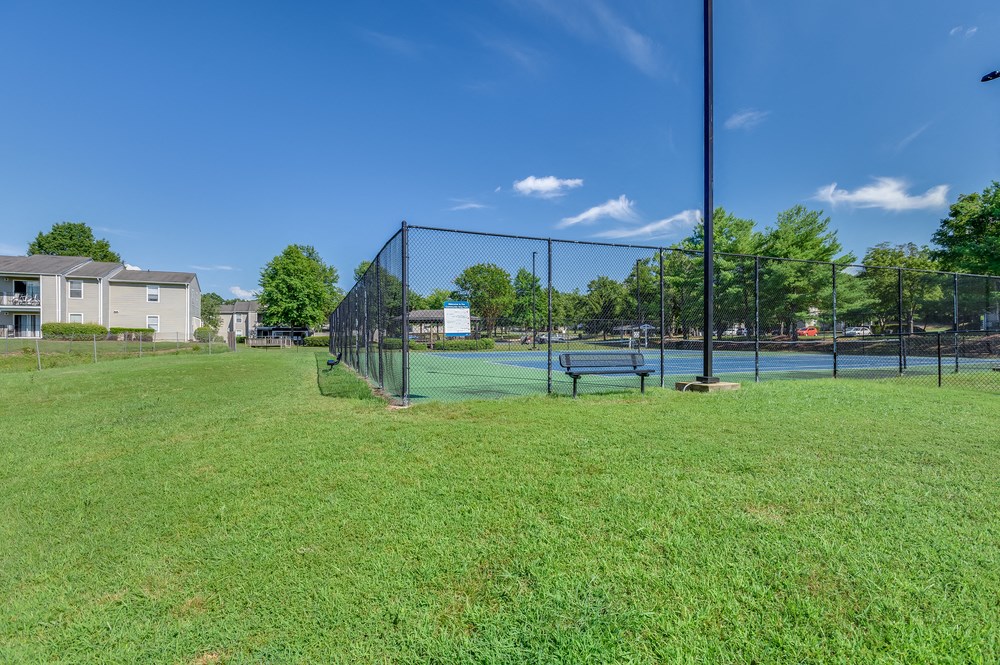 the preserve at ballantyne commons park with a tennis court and fence