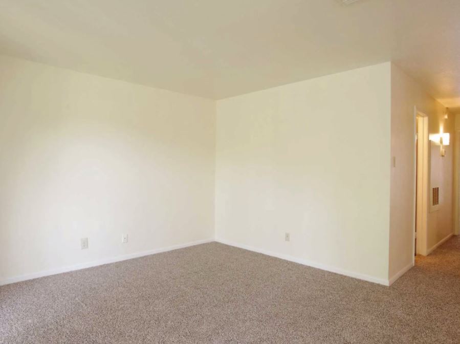 Living Room view  with sandy colored carpets and eggshell white walls