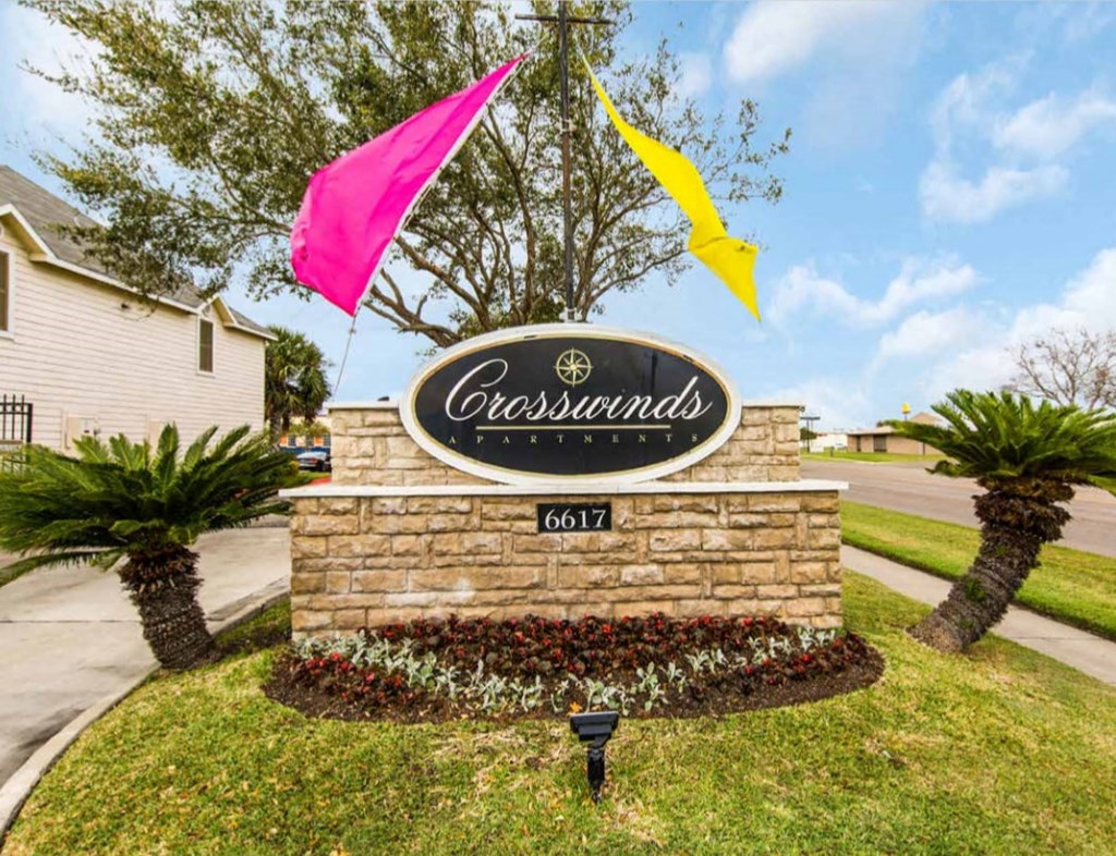 our sign is in front of our front yard with flags