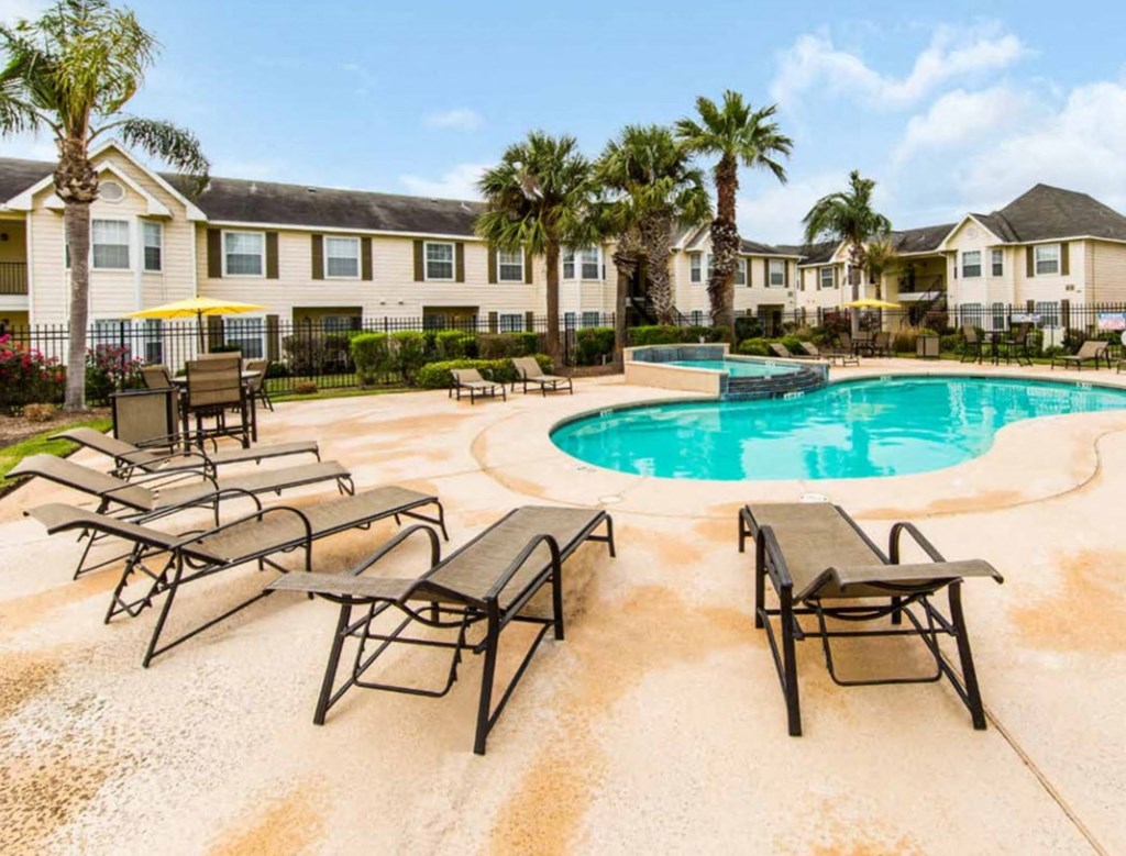 our apartments have a large pool and lounge chairs