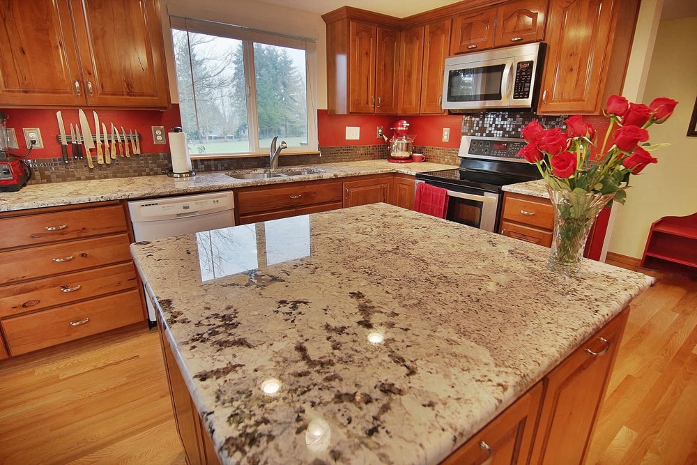 a kitchen with a granite counter top