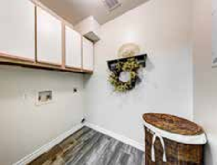 a white room with a bar and a table