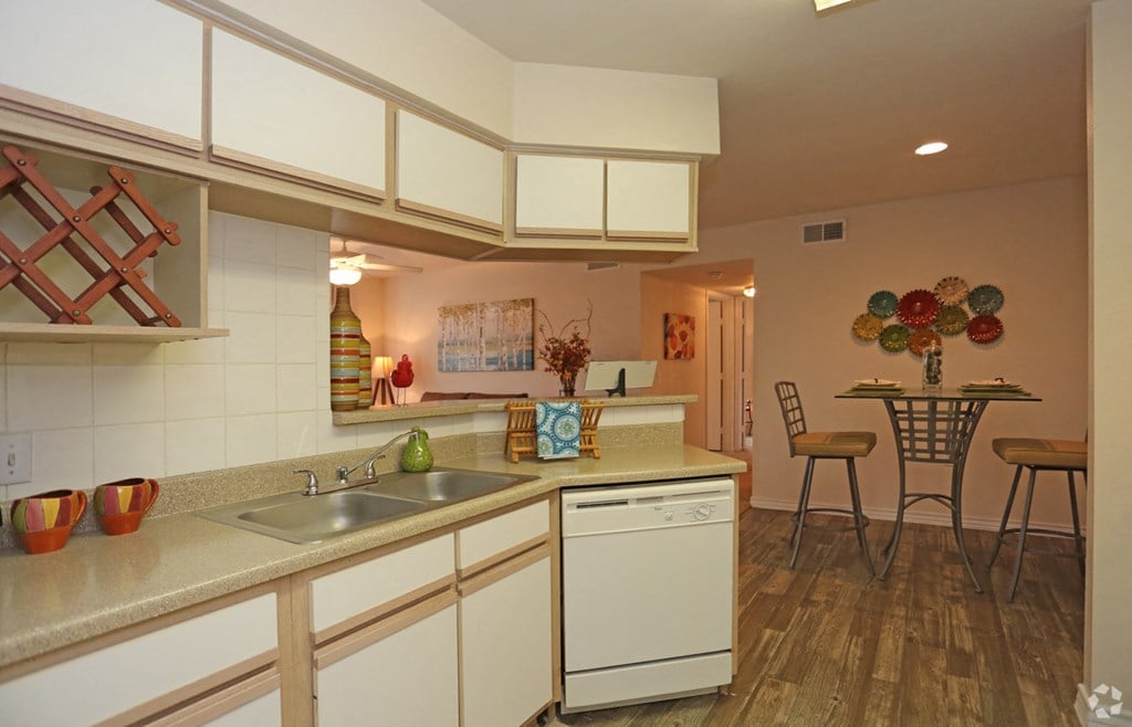 a kitchen with a sink and a counter top