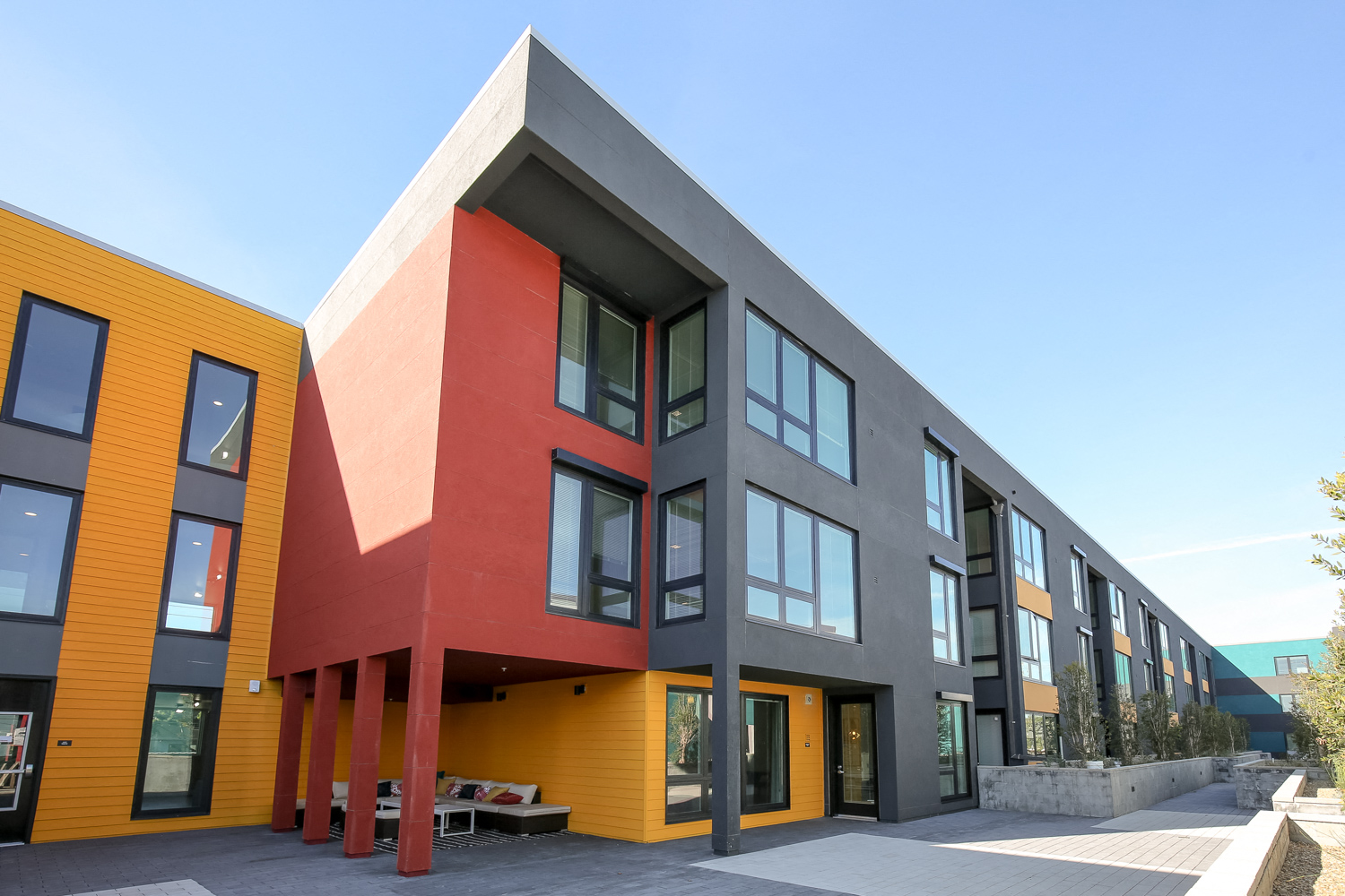 View of building and outdoor seating from interior podium