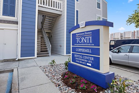 a sign for theonti occupational rental center in front of a house