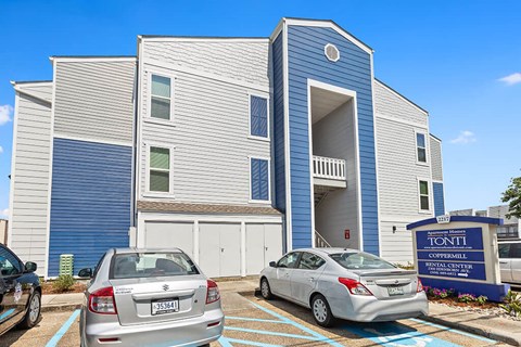 a building with cars parked in front of it