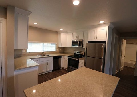 Kitchen with island l Brairwood Apartments in Livermore, CA 