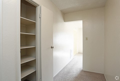 Closet with shelves l Marina Plaza Apartments in San Leandro CA