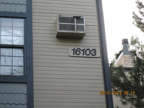 the front of a house with a unit on the side of it