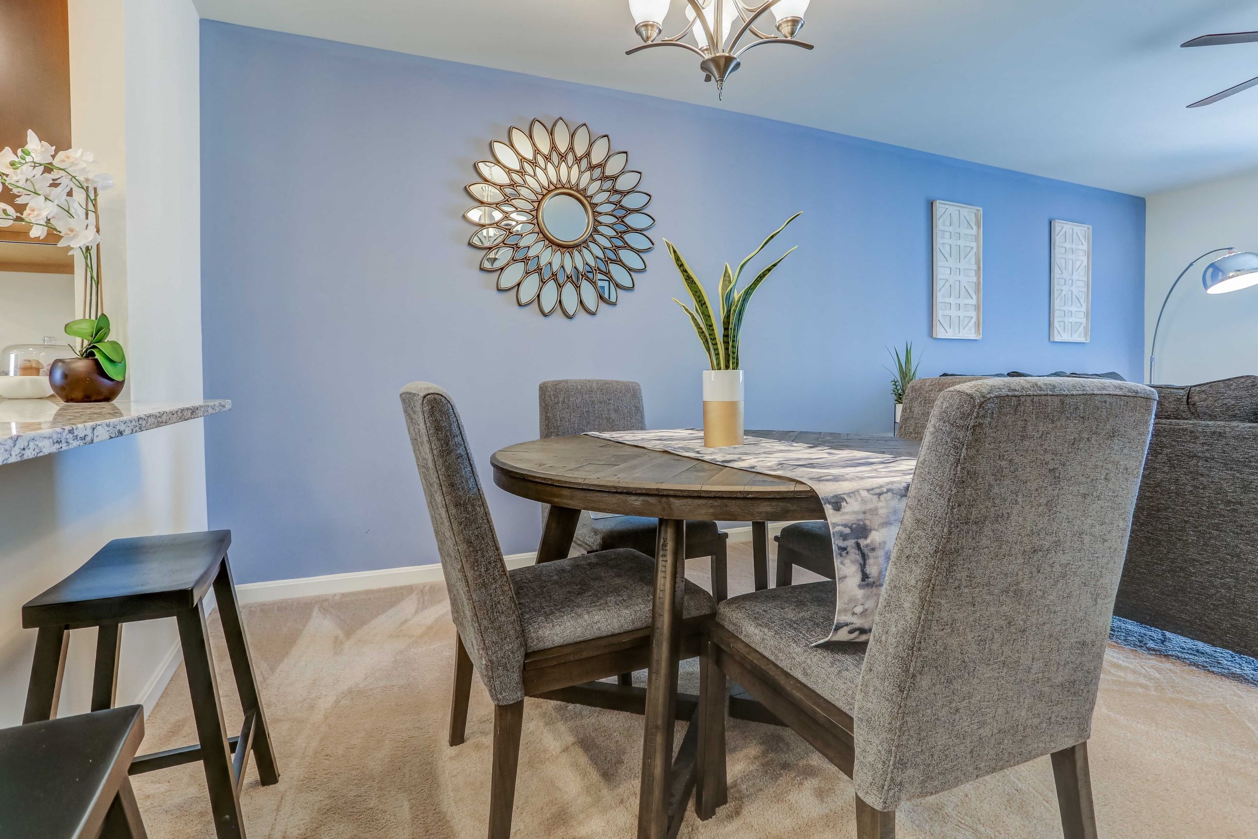 a dining room with a table and chairs