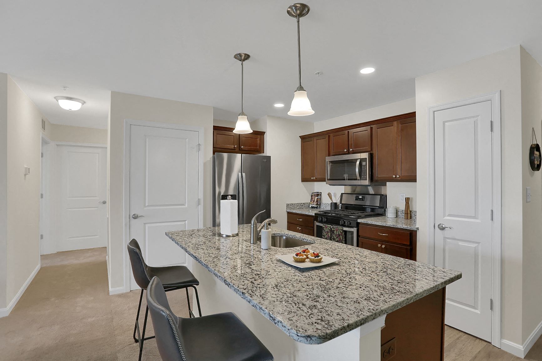 a kitchen with a granite counter top