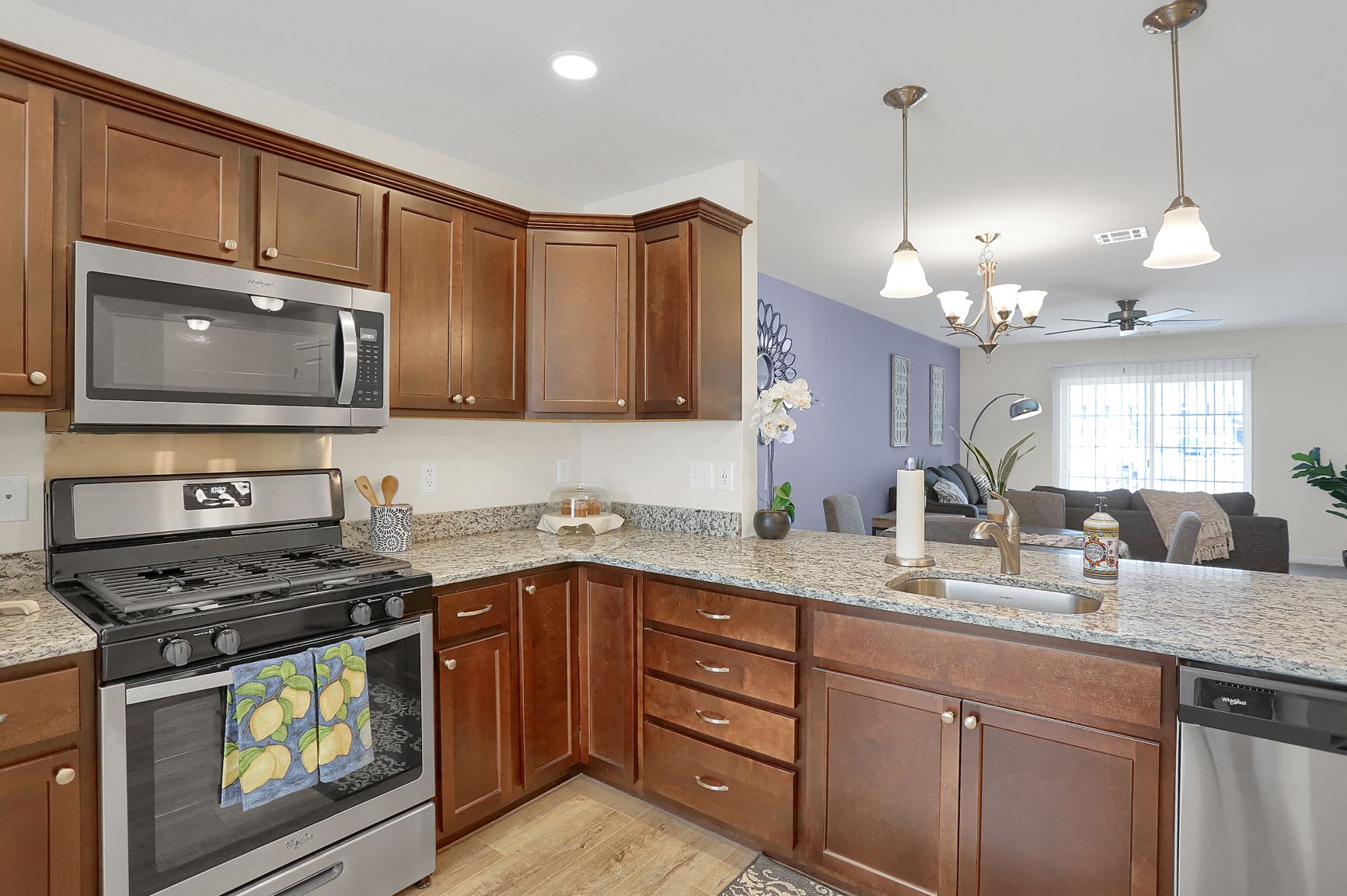 a kitchen with stainless steel appliances and granite counter tops