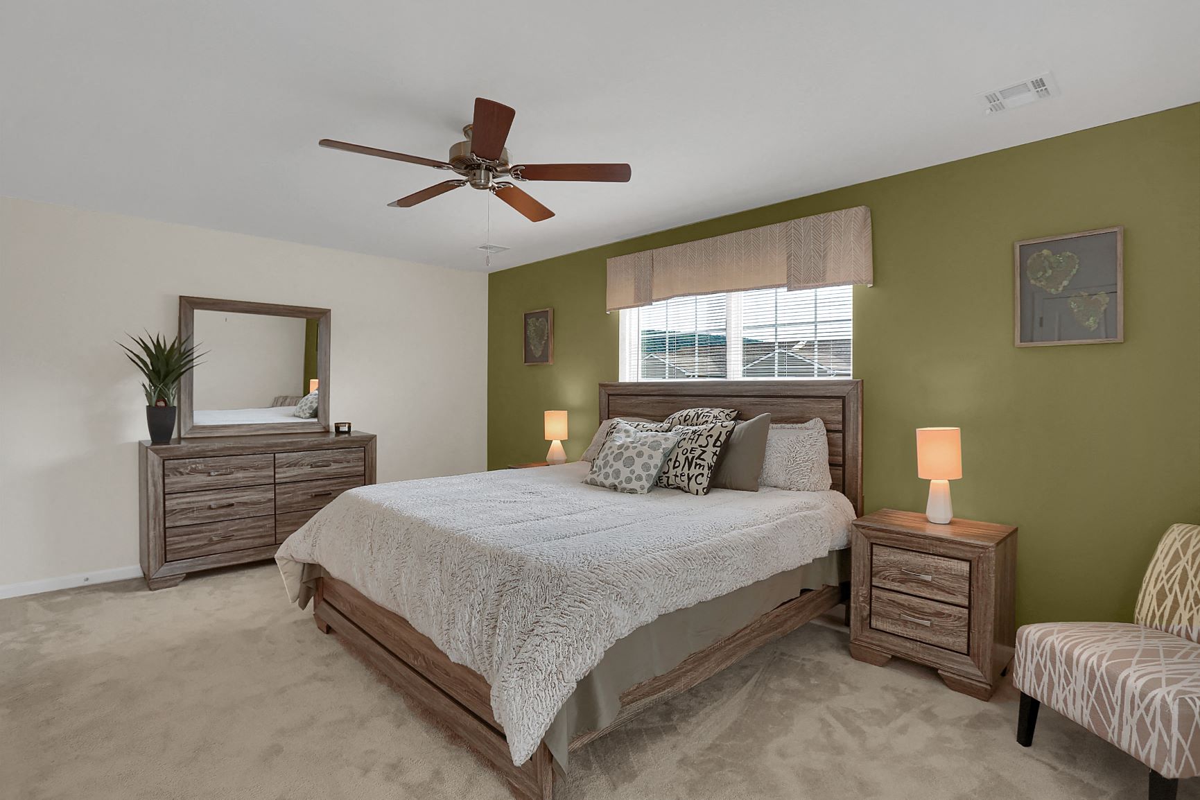a bedroom with a bed and a ceiling fan