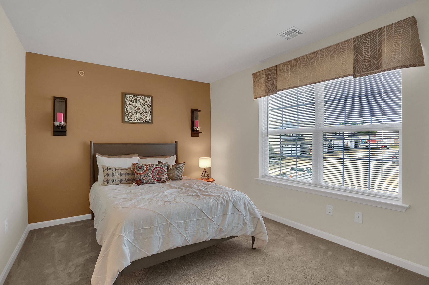 a bedroom with a bed and a window