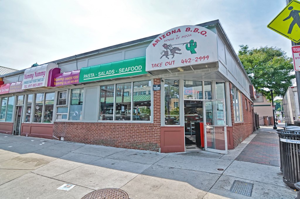 the front of a restaurant on the corner of a street