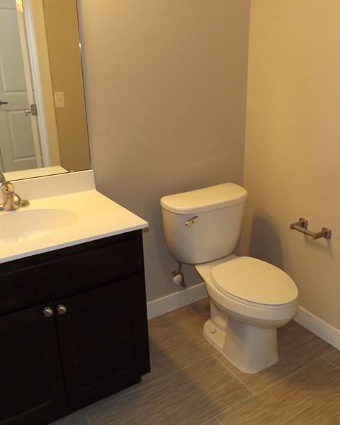 a bathroom with a toilet and a sink
