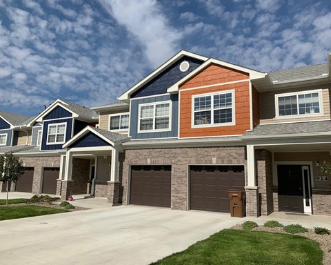 a row of houses with garage doors