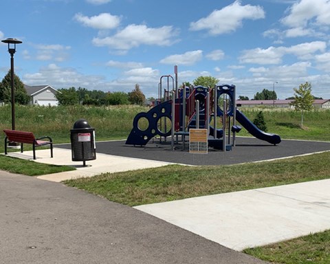 a playground at a park on a sunny day