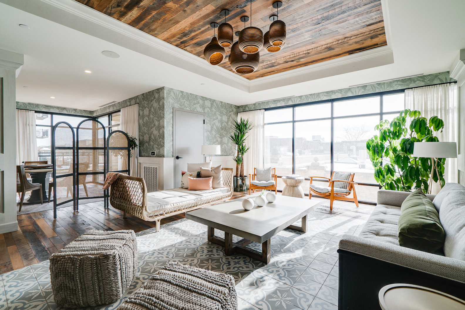 a living room with couches and chairs and a coffee table
