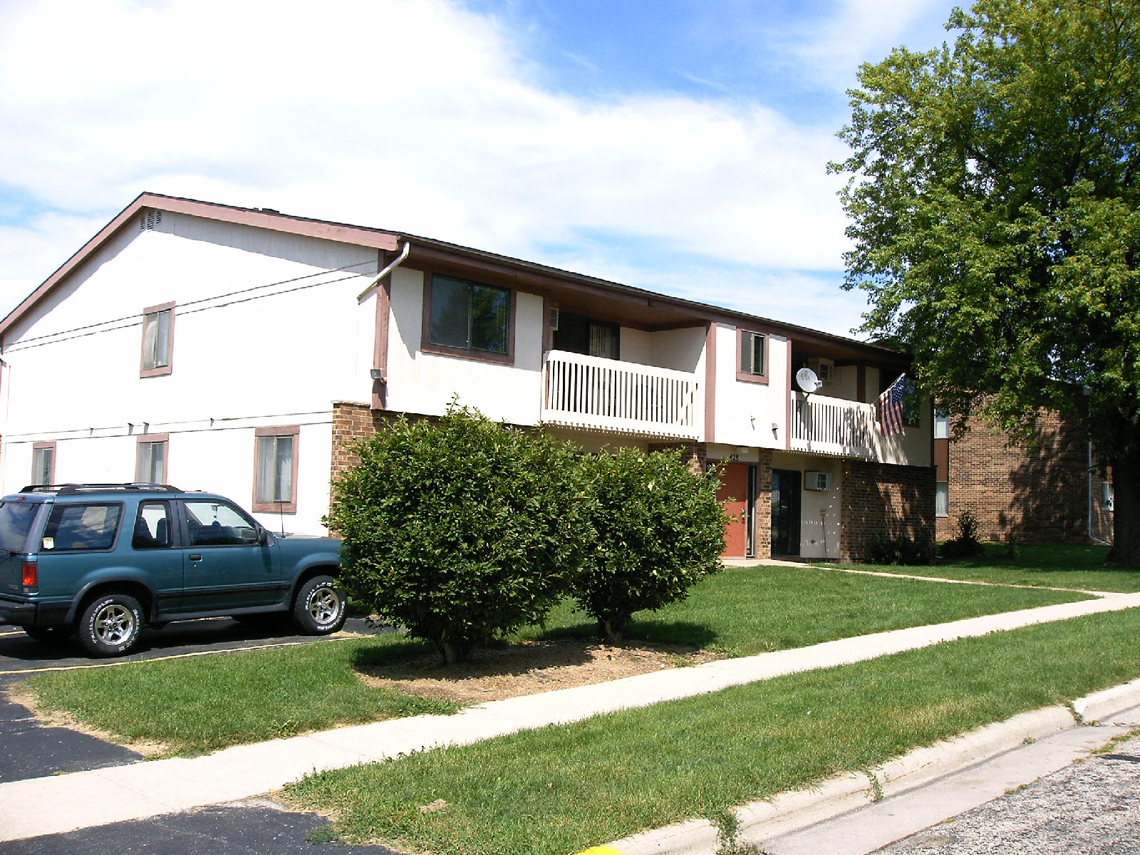 a house with a truck parked in front of it