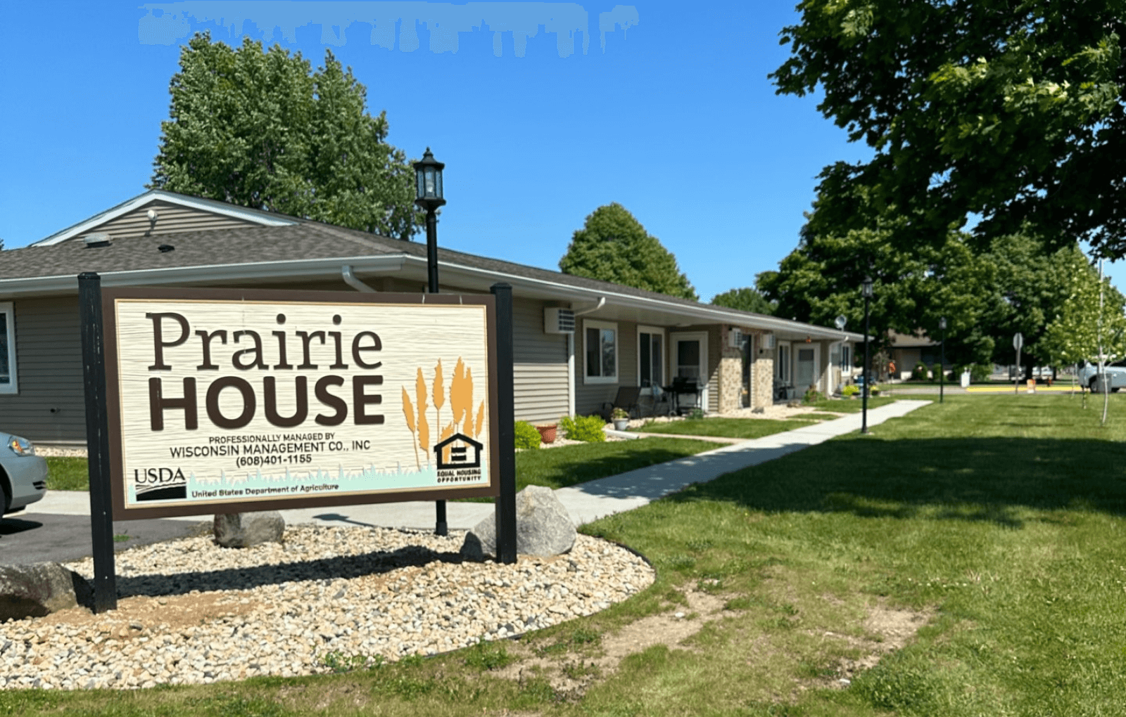 a sign in front of a house that says prairie house