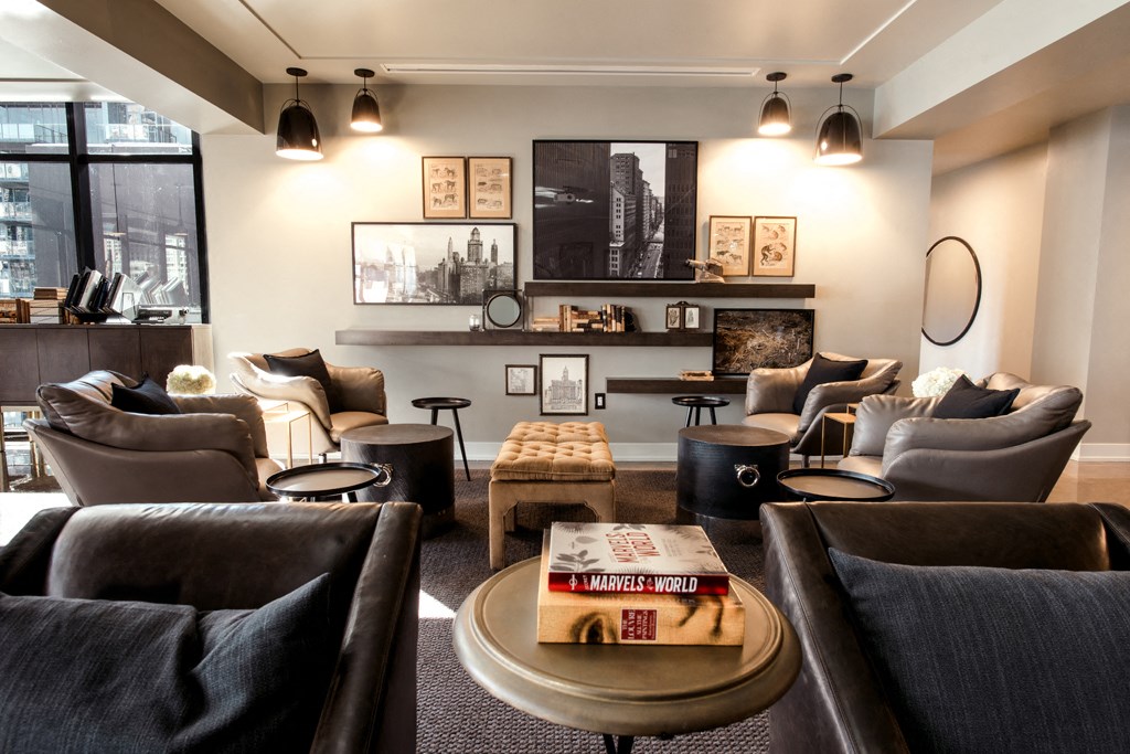 a living room with couches and chairs and a table