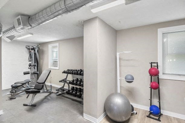 the gym has a lot of exercise equipment in it