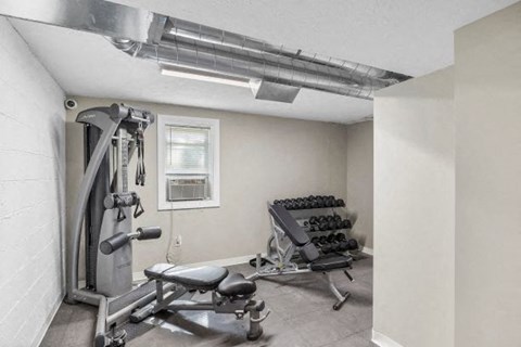 a gym with a lot of equipment in it