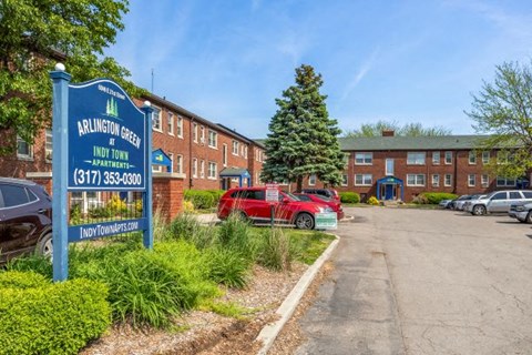 a red car parked in front of a building