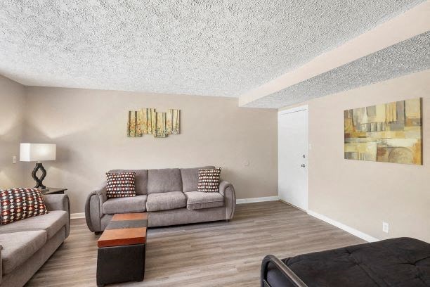 a living room with a couch and a bed