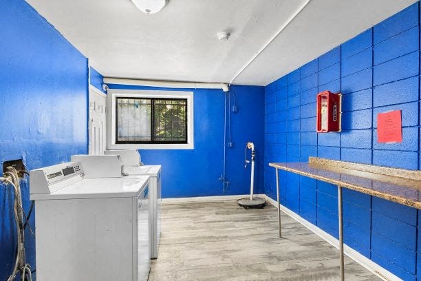 a bathroom with a sink and a blue wall