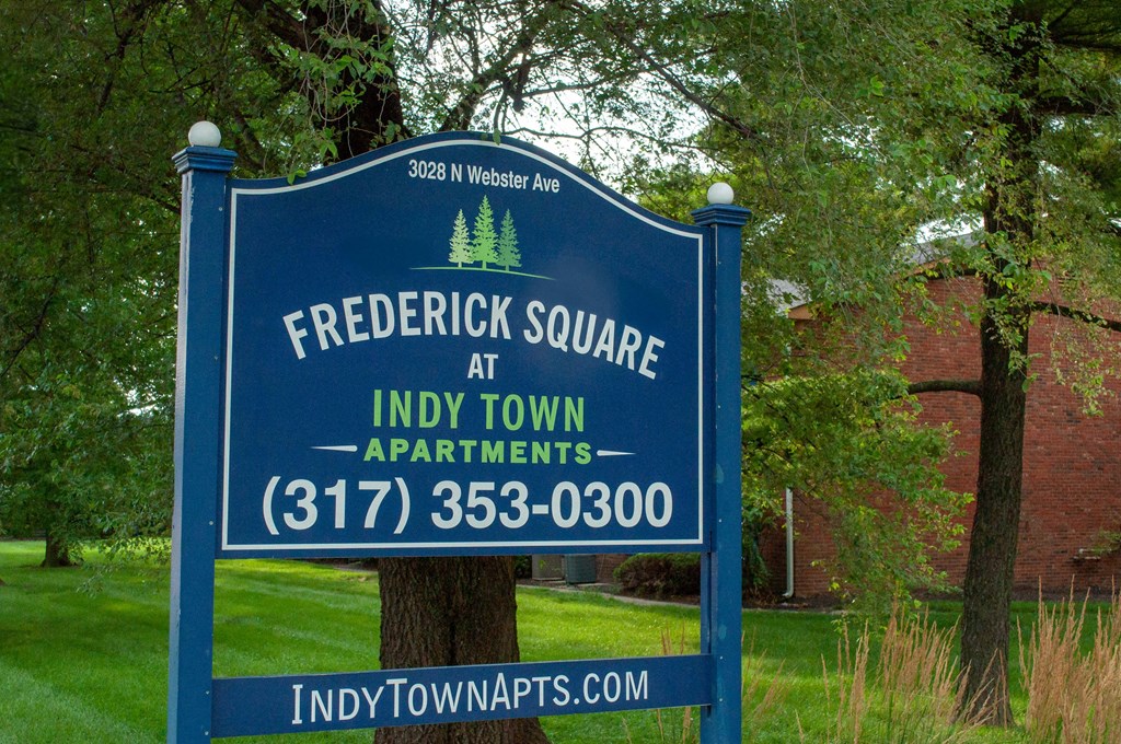 a sign that readsfrederick square apartments
