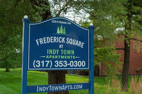 a sign that readsfrederick square apartments