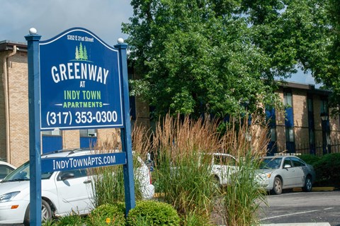 a sign for the greenway apartments
