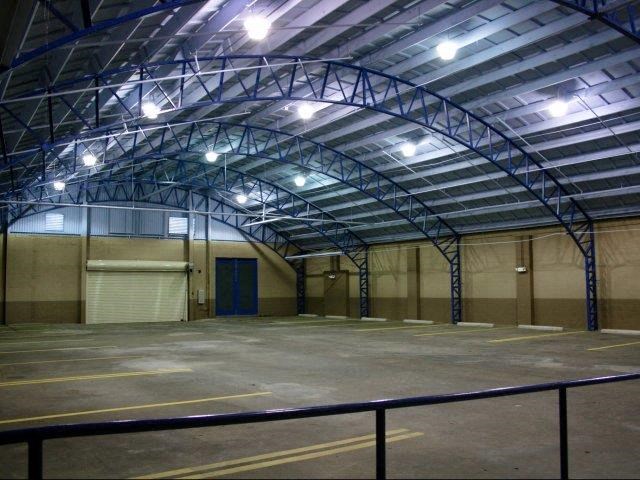 an empty parking lot with a blue door