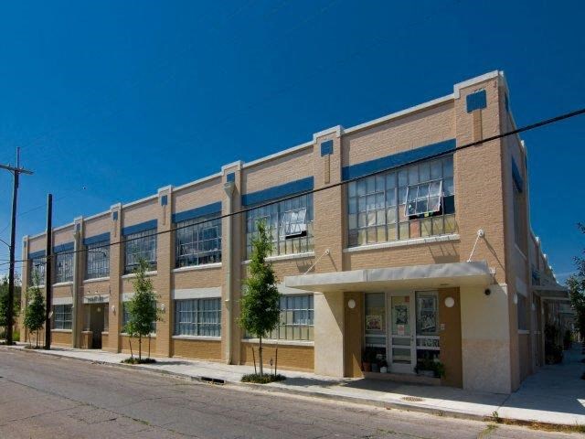 a large brick building on the side of a street