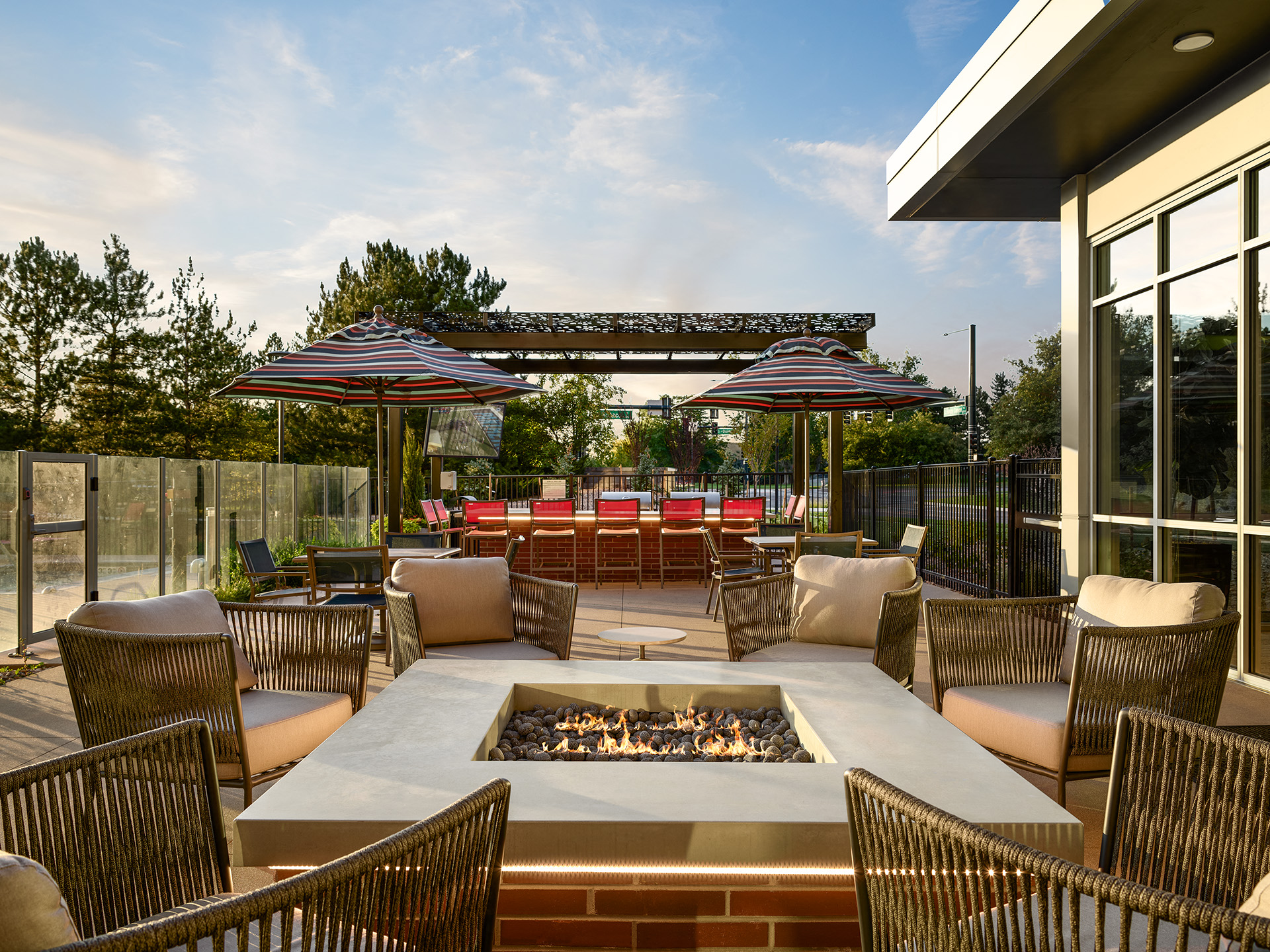Firepit lounge poolside at Tangent Apartments in Denver, CO