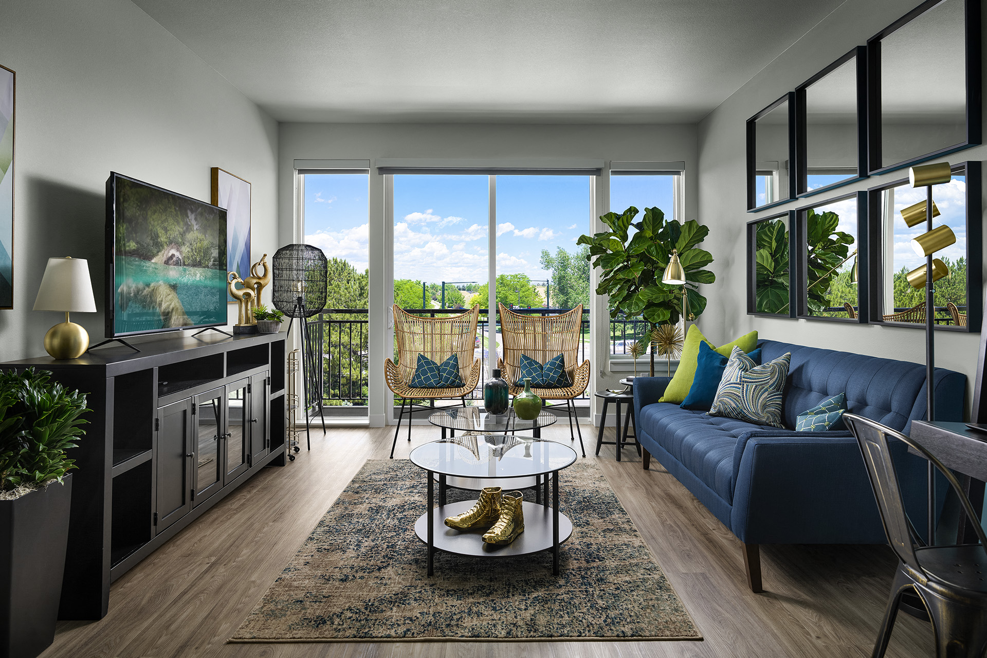 a living room with a blue couch and a table