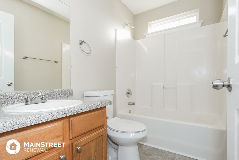 a bathroom with a sink toilet and a shower