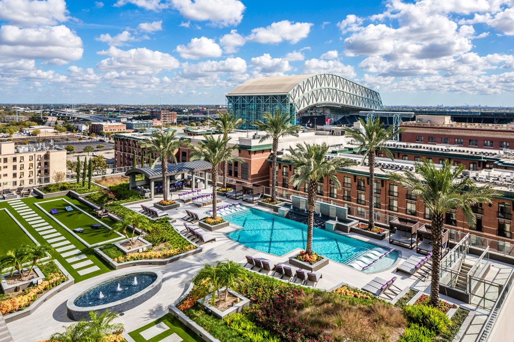 a view of a pool and the city