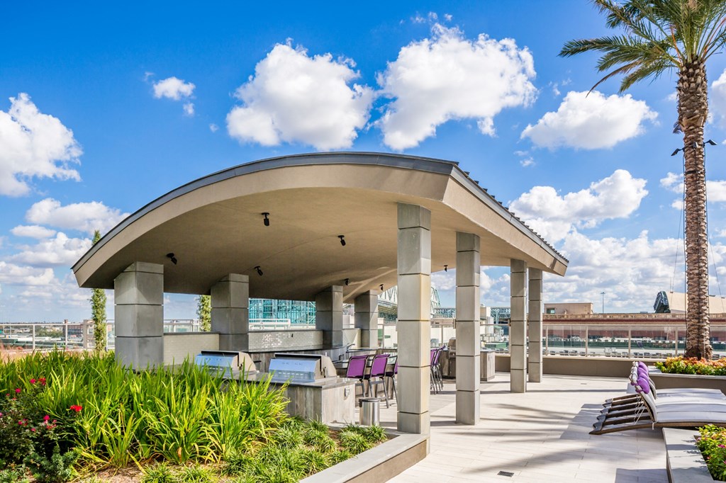 a building with a patio and palm trees