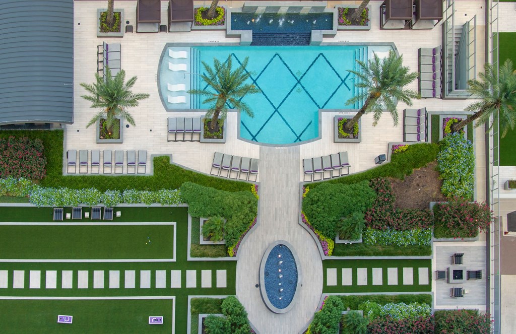 a rendering of the pool area of an apartment building with a pool and a courtyard