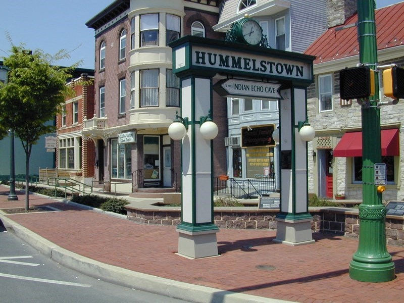 a street sign on the corner of a city street