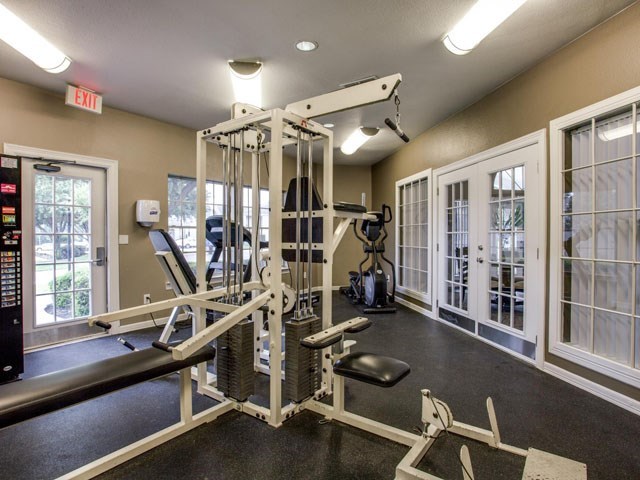 the gym in the home has a lot of exercise equipment