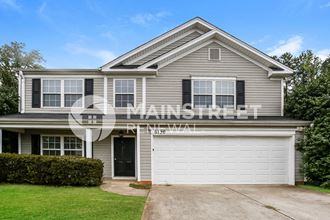 a gray house with a white garage door
