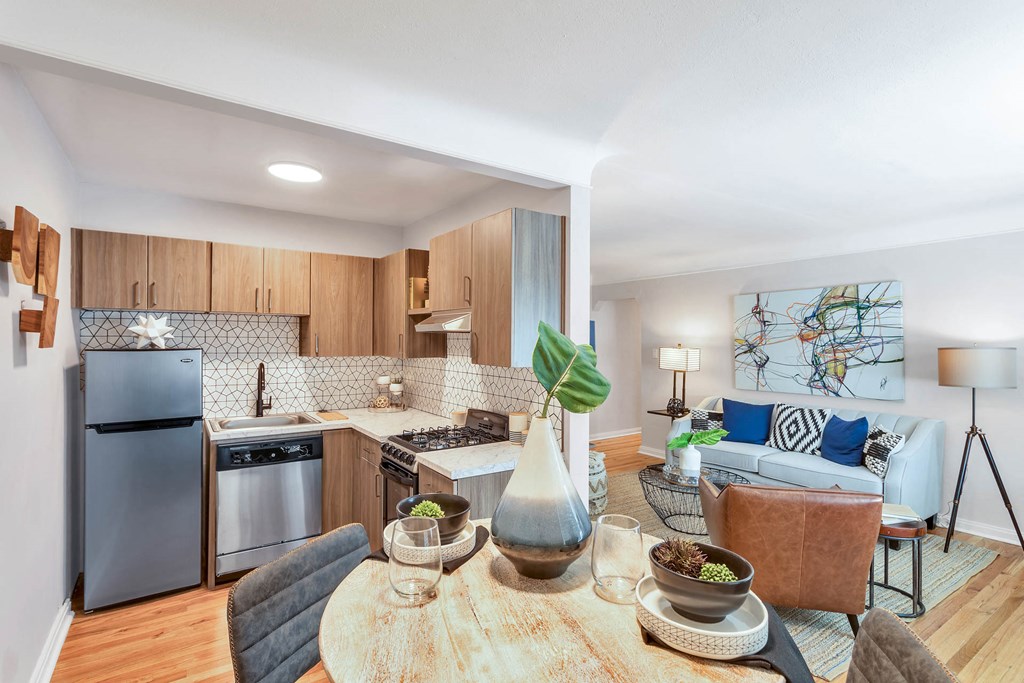 a kitchen and living room with a table