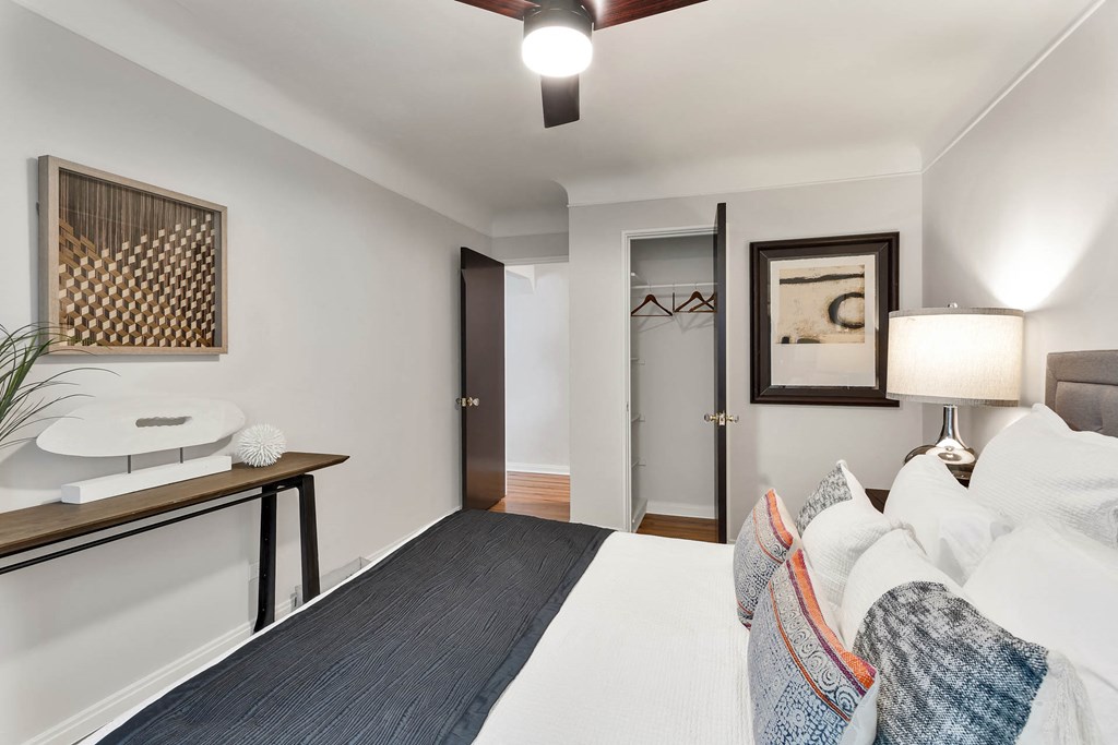 a living room with a couch and a desk